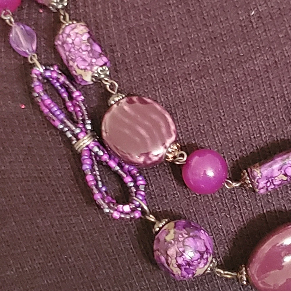 Gunmetal double strand necklace with purple seed bead bows and marble look beads